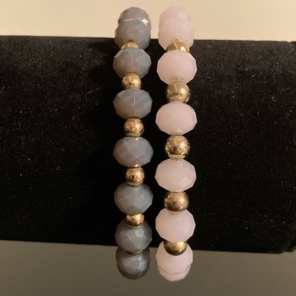 Grey pink and golden beaded bracelets. Two bracelets